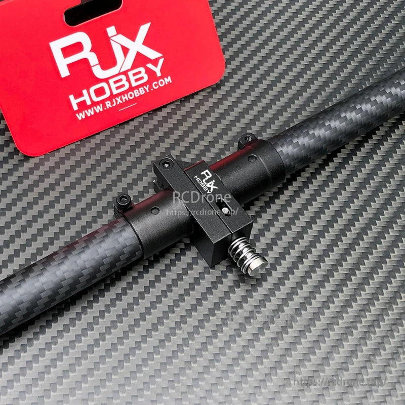 RJX Hobby aluminum folding arm tube joint clamp with spring latch mounted on a carbon fiber tube