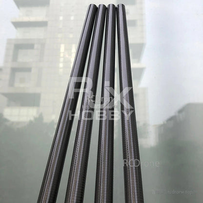 Four tapered carbon fiber tubes with a woven finish, cone-shaped for hobby builds and custom frames.