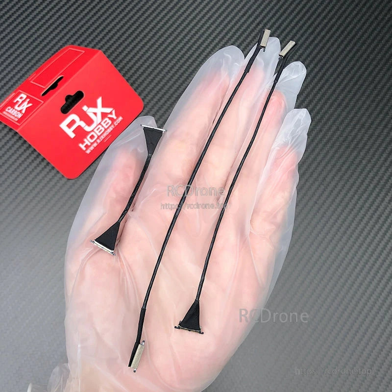 RJXHOBBY DJI O4/O4 Pro compatible coaxial cables with small connectors, shown in hand with packaging