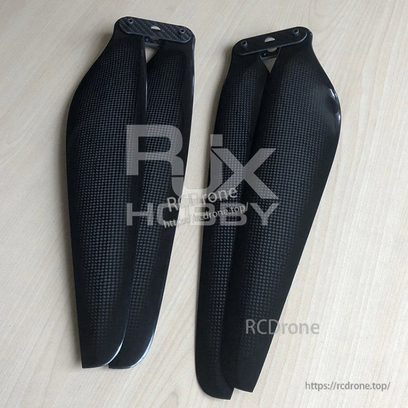 RJXHOBBY 26*8.5in Carbon Fiber Folding Propeller, RJXHOBBY 26x8.5 inch carbon fiber folding propeller blades in black with textured finish laid side by side.