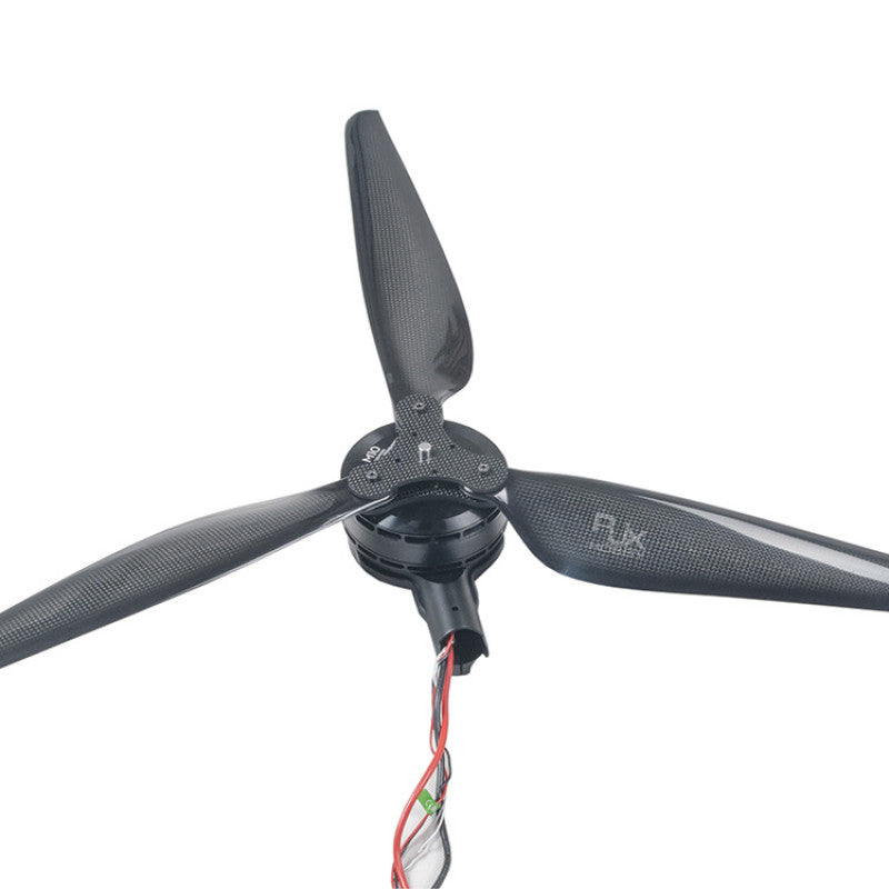 RJX 3-blade carbon fiber drone propeller mounted on motor hub with wiring, close-up view