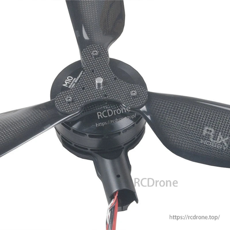 Close-up of RJXHOBBY carbon fiber 3-blade folding propeller mounted on an M10 drone motor hub