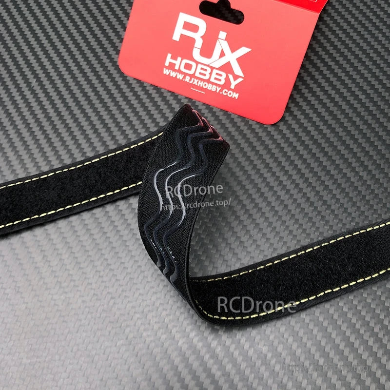 RJXHOBBY 25mm black battery strap with yellow Kevlar-style stitching and non-slip silicone grip lines