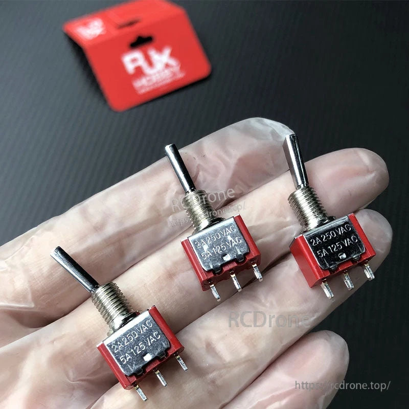 RJXHOBBY 2pcs 3-Position Reset Switch, RJXHOBBY 3-position toggle reset switches with red body and metal lever, labeled 2A 250VAC 5A 125VAC