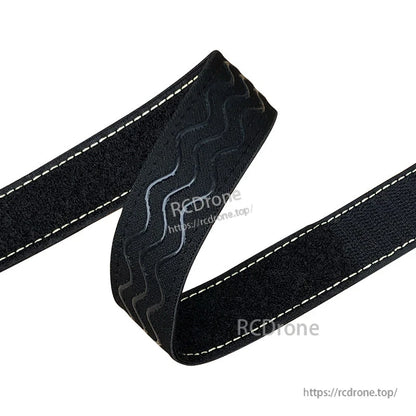 Black 30mm battery strap with white stitching and wavy non-slip silicone grip strip for RC packs
