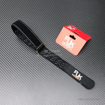 RJXHOBBY black 30mm battery strap with metal buckle and non-slip wavy silicone grip, with retail packaging