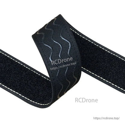 Black non-slip silicone battery strap with white stitched edges and grippy wavy texture for RC builds