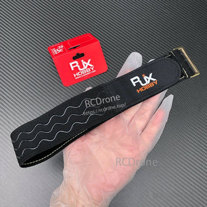 RJXHOBBY non-slip silicone battery strap with wavy grip pattern, stitched edges, and metal buckle