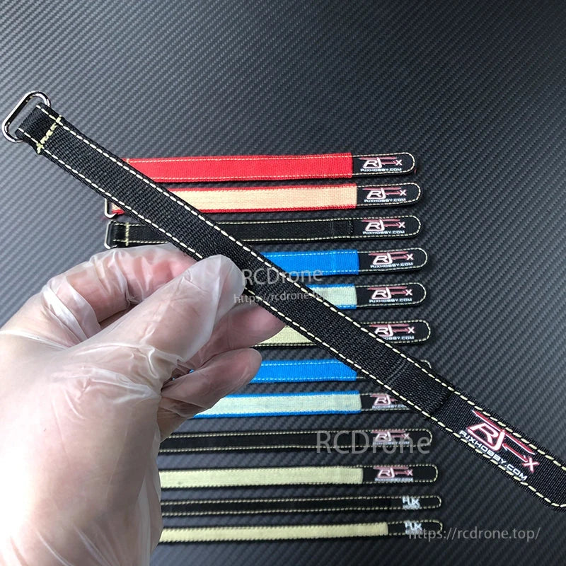RJXHOBBY 2pcs Kevlar Battery Strap, RJXHOBBY Kevlar battery strap with metal buckle, black stitched strap held in hand over assorted colors