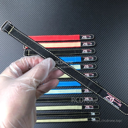 RJXHOBBY 2pcs Kevlar Battery Strap, RJXHOBBY Kevlar battery strap with metal buckle, black stitched strap held in hand over assorted colors