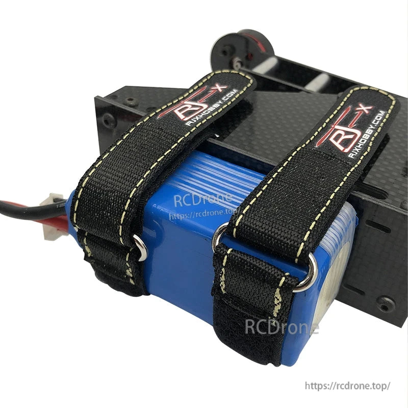 RJXHOBBY 2pcs Kevlar Battery Strap, Two RJXHOBBY Kevlar battery straps with metal loops securing a blue LiPo pack to a carbon fiber plate