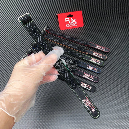 RJXHOBBY kevlar-stitched non-slip silicone battery strap with metal buckle and black wavy grip pattern