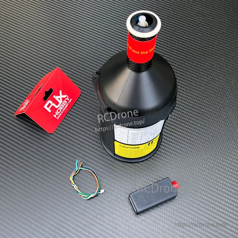 RJXHOBBY fiber-optic data link spool module with red top connector, wiring lead, and small power module