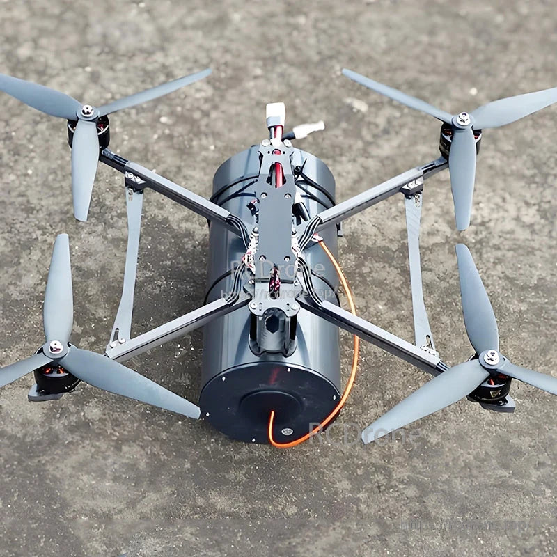 FPV quadcopter with a large fiber-optic data link spool mounted underneath and an orange tether line attached