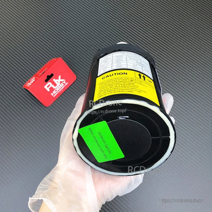 RJXHOBBY fiber-optic data link module spool with caution label and FC/UPC connector tag in hand