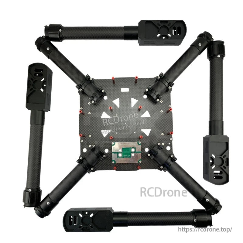 Aluminum clip-style tube clamp mounted on a carbon fiber drone arm, securing a 30mm round tube joint
