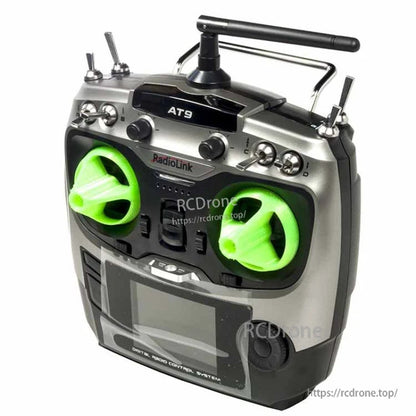 RC transmitter with bright green 3D printed stick rocker covers installed on both control gimbals