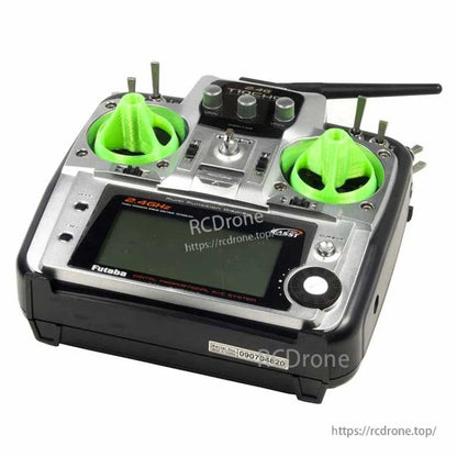 RC transmitter with bright green 3D printed gimbal stick (rocker) covers installed on both control sticks