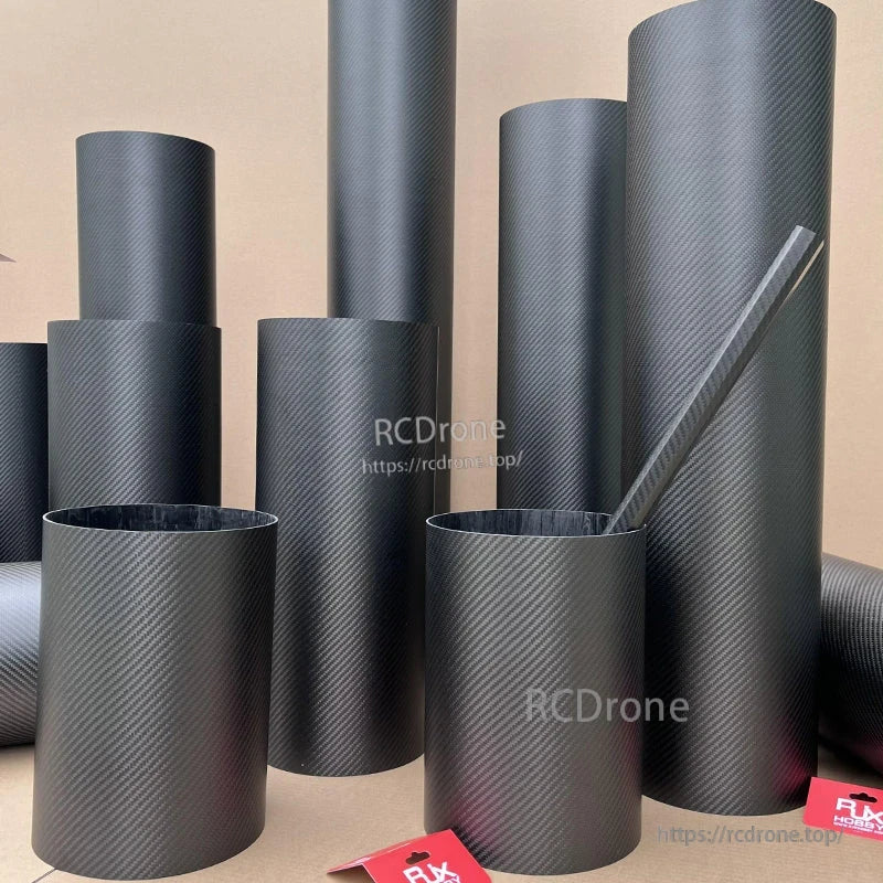 RJXHOBBY 3K Carbon Fiber Round Tube, 3K carbon fiber round tubes in multiple diameters with a twill weave finish, grouped upright on a beige background