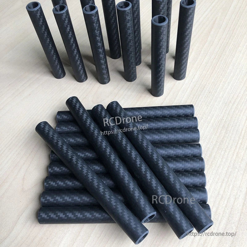 RJXHOBBY 3K Carbon Fiber Round Tube, 3K carbon fiber round tubes with twill weave finish, hollow cylinders in assorted lengths on a tabletop