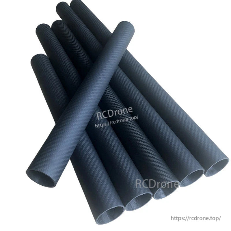 Stack of black 3K carbon fiber round tubes with twill weave finish and hollow ends, 1000mm length