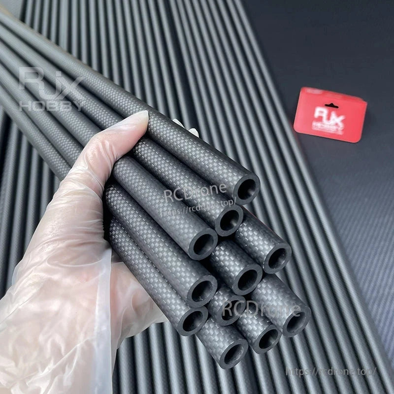 RJXHOBBY 3K Carbon Fiber Round Tube, Bundle of 3K carbon fiber round tubes with hollow ends and woven finish, held in hand for sizing
