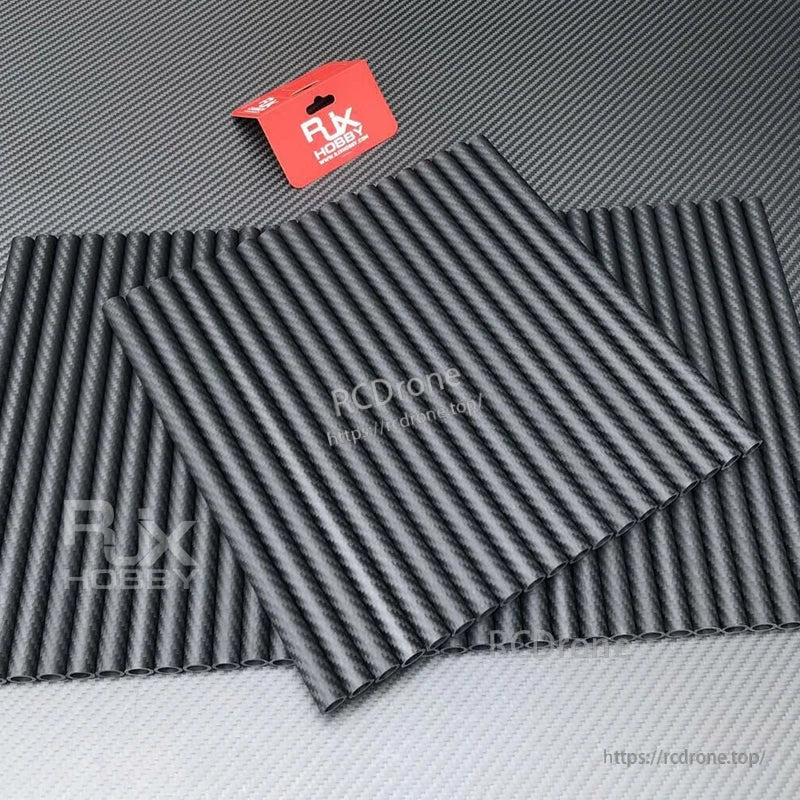 Bundle of RJXHOBBY carbon fiber round tubes with woven finish, hollow ends, arranged in overlapping stacks