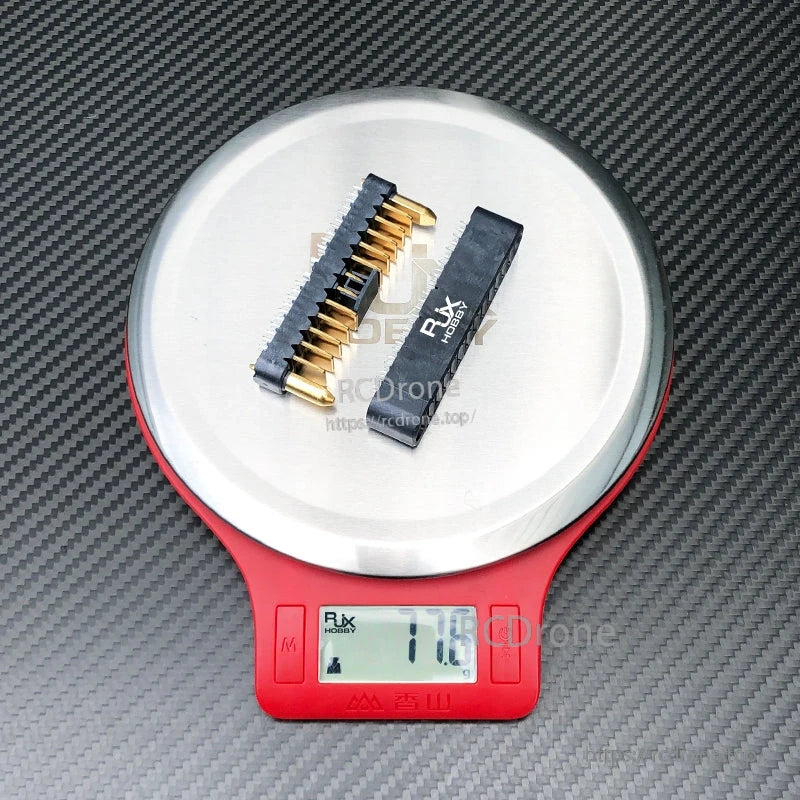 RJXHOBBY DJI Agras battery interface connector replacement pair with gold pins, shown on a scale (17.6 g)