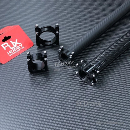 Black aluminum 40mm split pipe/tube clamp with four bolts, fitted around a carbon fiber tube