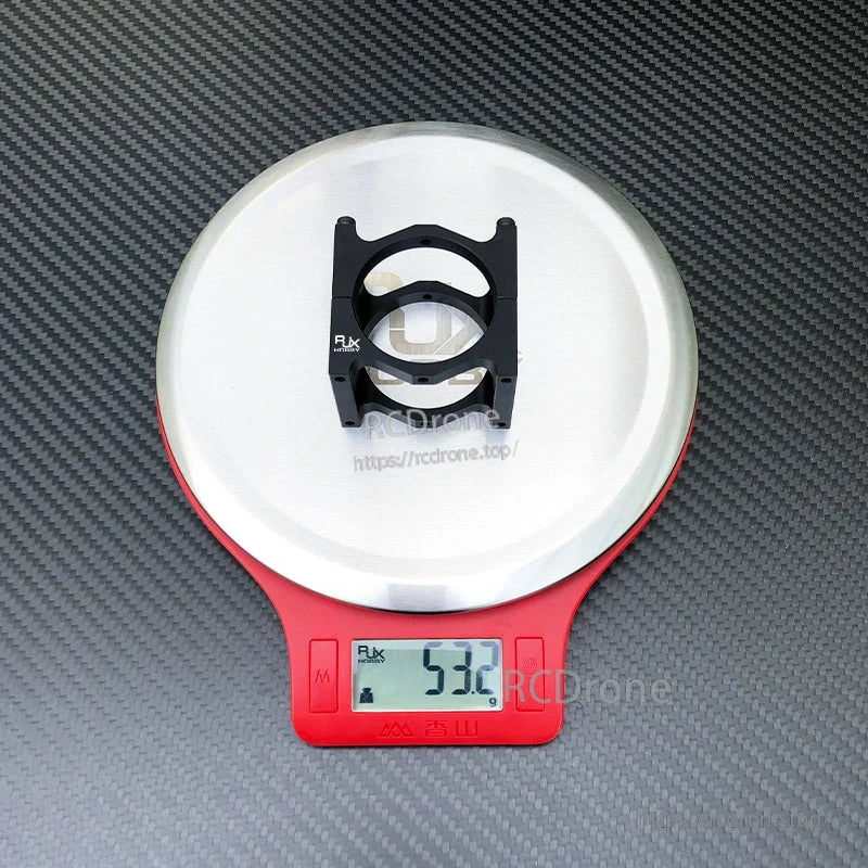 RJXHOBBY black pipe clip tubing clamp on a digital scale, showing a weight of about 53.2 g