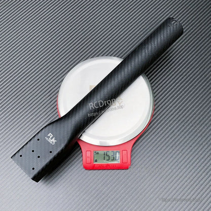 Carbon fiber UAV multicopter replacement arm with mounting plate holes, weighing about 153 g on a digital scale