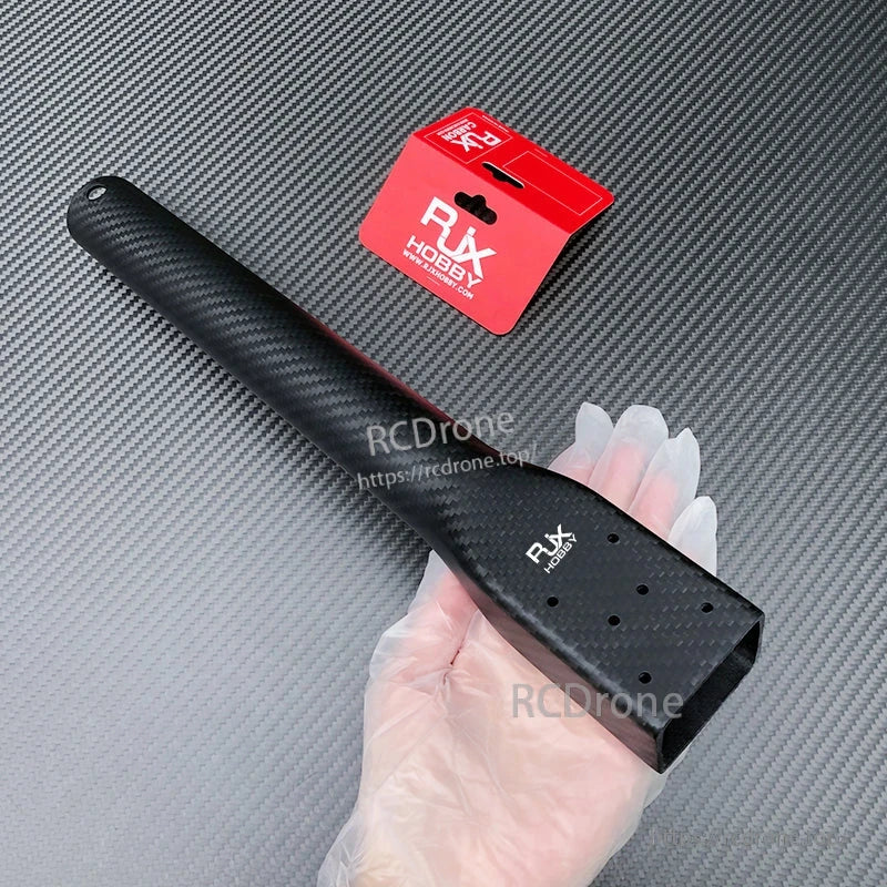 RJXHOBBY carbon fiber arm for plant protection UAV, D40 tube with rectangular motor mount held in a gloved hand