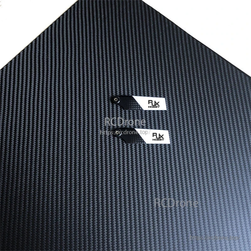 Pair of RJXHOBBY black and white carbon fiber tail rotor blades with mounting holes and logo