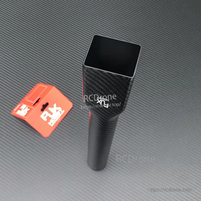 Carbon fiber UAV multicopter arm tube with square end and red RJX mounting clamp on carbon weave surface