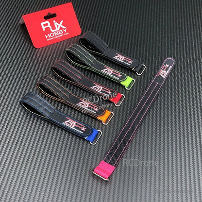 RJXHOBBY Kevlar battery straps with metal buckles in multiple colors on a carbon fiber surface