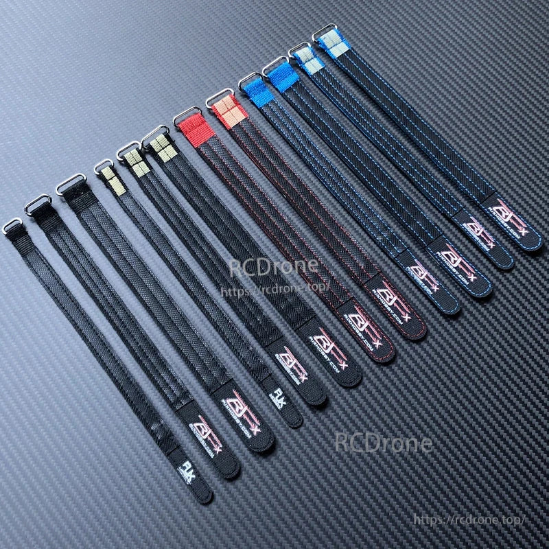 Assorted RJXHOBBY Kevlar battery straps with metal buckles in black, red, and blue for securing RC packs