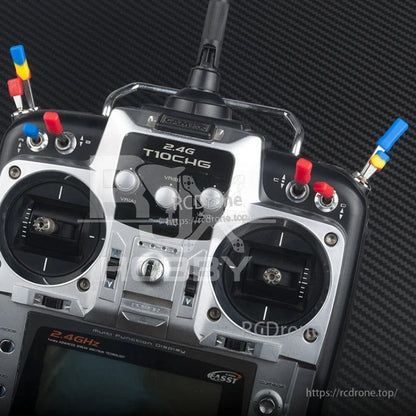 RJXHOBBY Non-Slip Transmitter Switch Cover, RC transmitter with red, blue, and yellow non-slip switch covers on toggle switches for easier grip