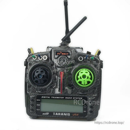 RC transmitter with 8mm gimbal stick protective covers installed, one black and one green on the control sticks