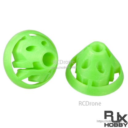 Green 3D-printed RC transmitter stick protective covers with vented dome design, shown as a pair