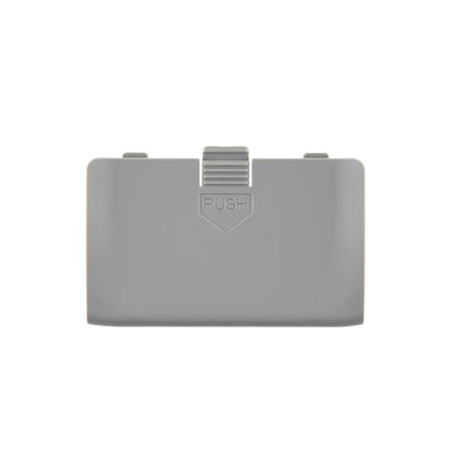 Gray replacement battery cover with centered push-release latch, front view