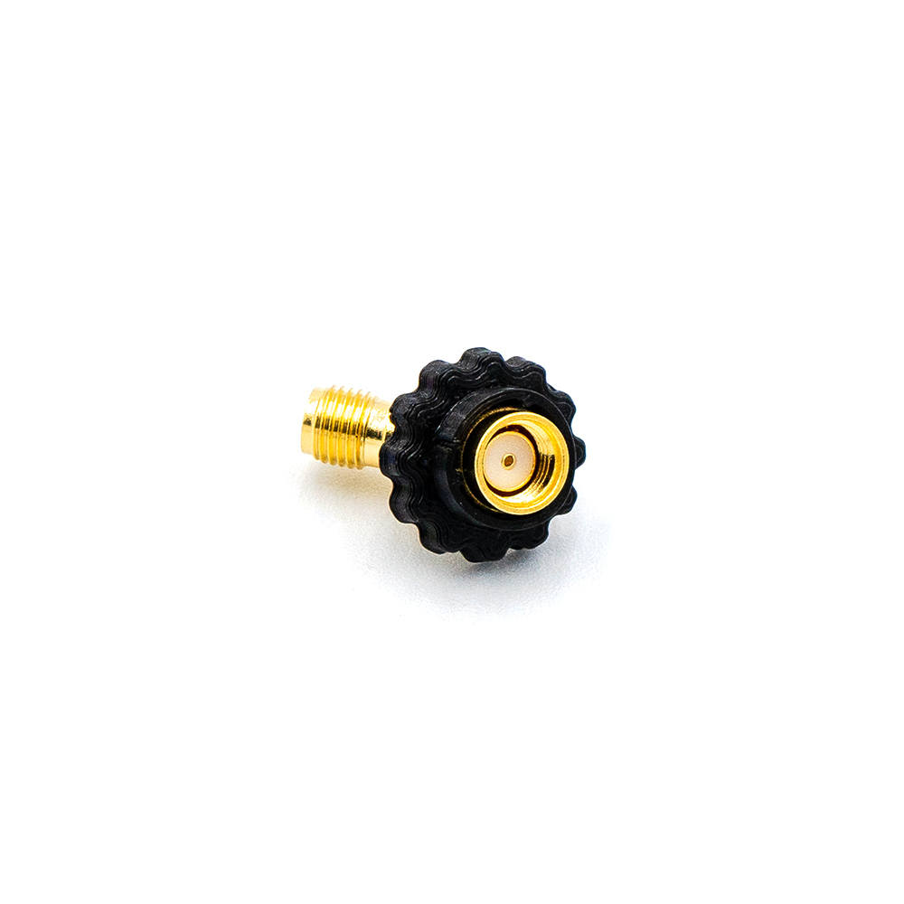 Connector close-up of SMA female end with center pin and black knurled thumbscrew on 45-degree adapter