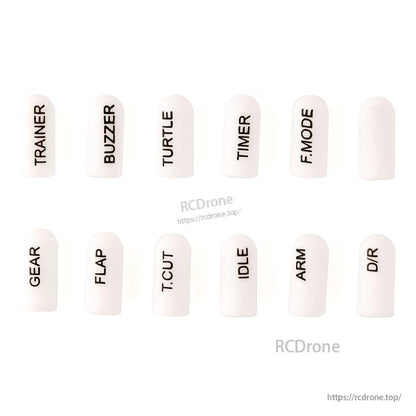 White short silicone switch cover set, 12 labeled dome caps with dark printed text