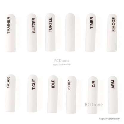 White long silicone switch covers with dark printed labels, 12-piece labeled set