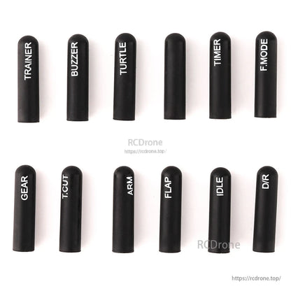 Black long silicone switch cover kit with white printed labels, 12 pieces arranged in two rows