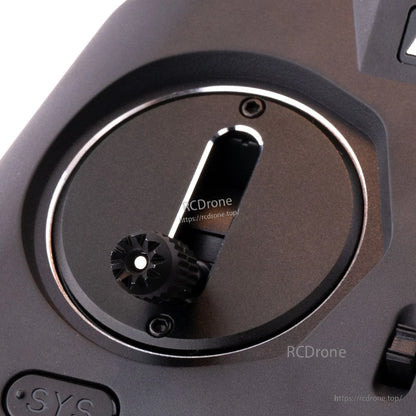 Stick shift gate plate on radio gimbal with vertical slot and thumb knob, angled close-up