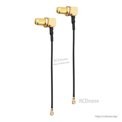 Two right-angle RP-SMA to micro coax pigtails shown full length on white background