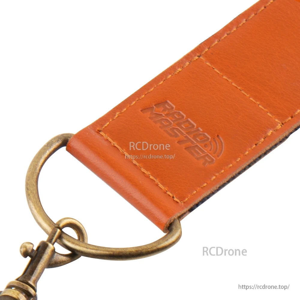 RadioMaster logo embossed on leather pad with brass ring attachment and stitching close-up