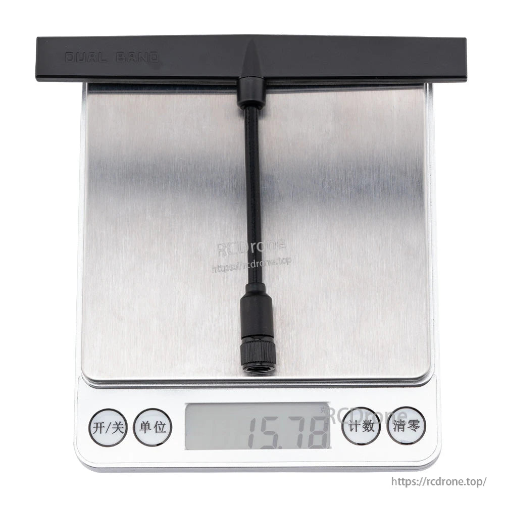 Dual band T antenna on digital scale showing 15.78 g weight reading