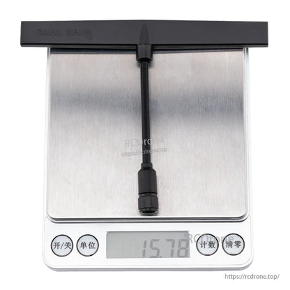 Dual band T antenna on digital scale showing 15.78 g weight reading