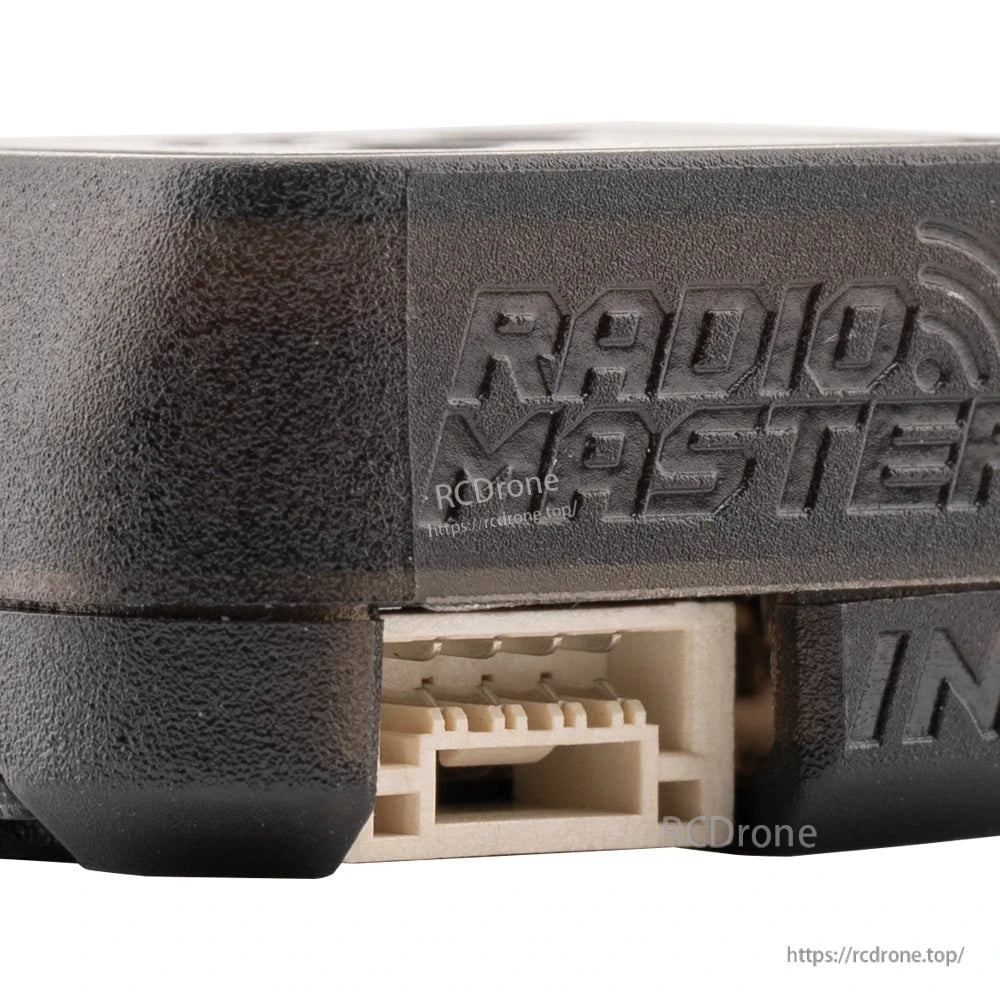 Close-up of connector port with embossed RadioMaster logo on ERS GPS casing